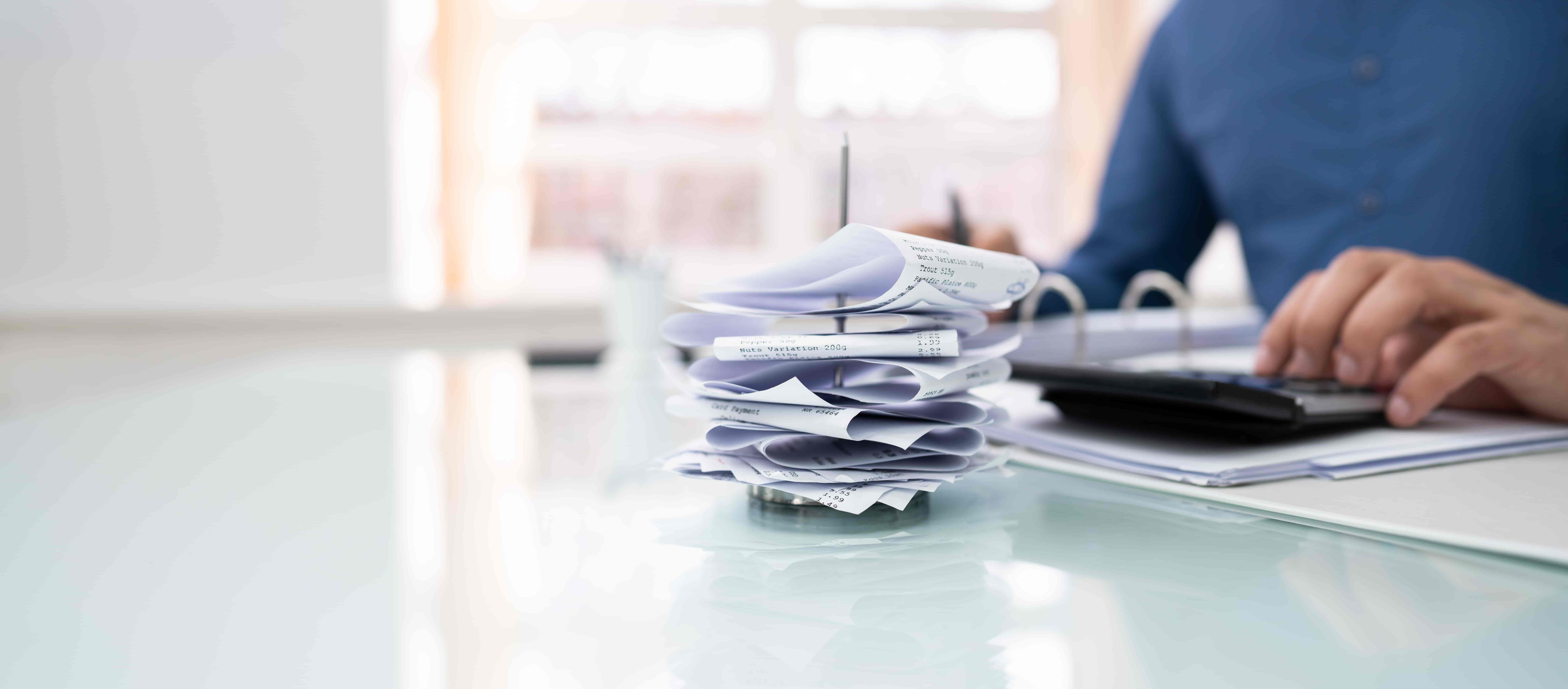 stack of receipts on desk